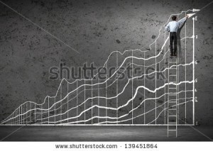 stock-photo-back-view-image-of-businessman-drawing-graphics-on-wall-139451864
